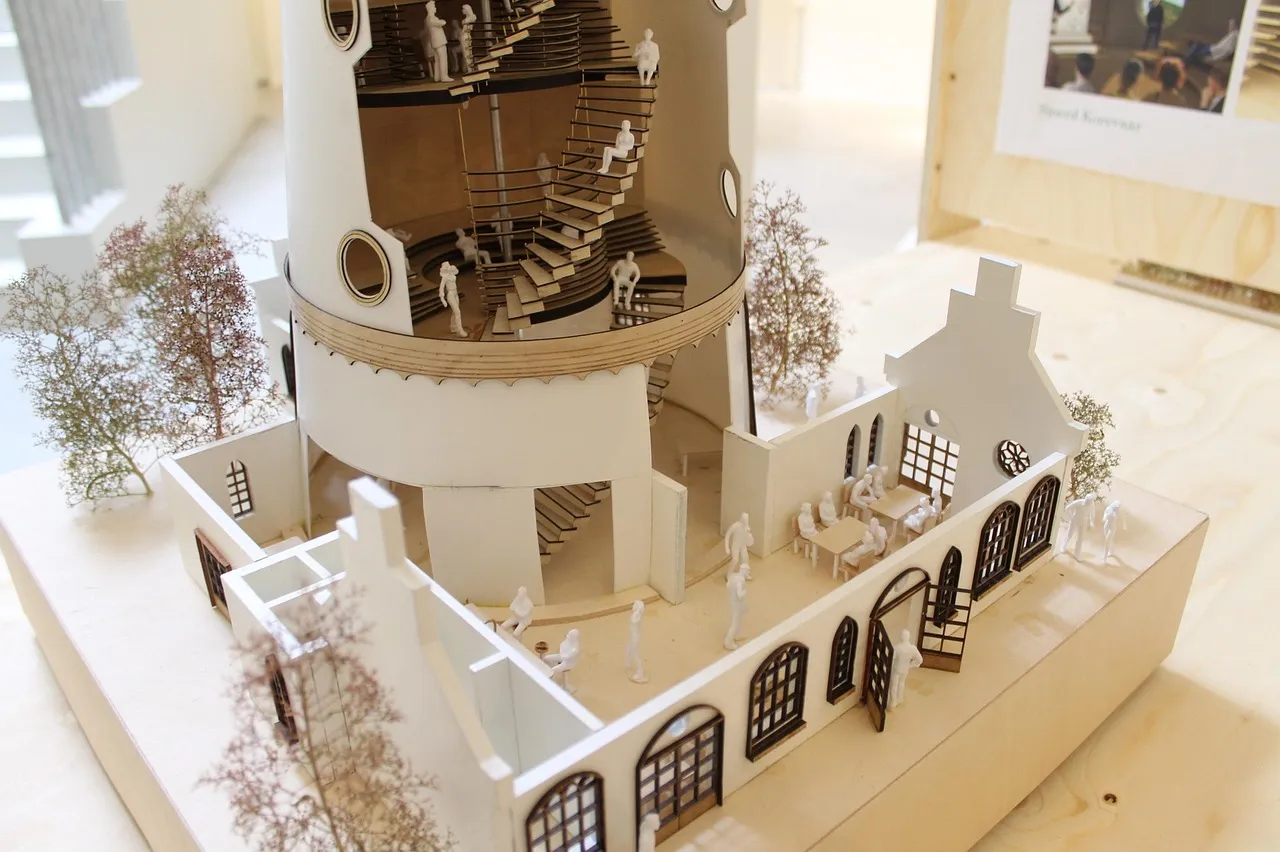 Maket rumah putih dengan pohon kecil